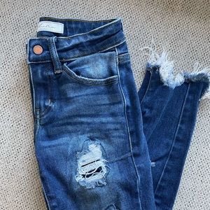 Girls KanCan distressed skinny jeans.